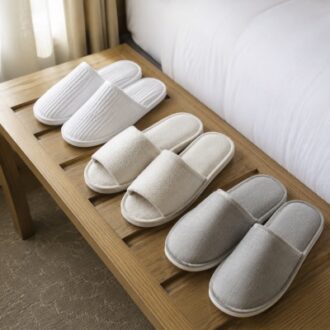 Wholesale hotel slippers with soft fabric uppers and individual packaging